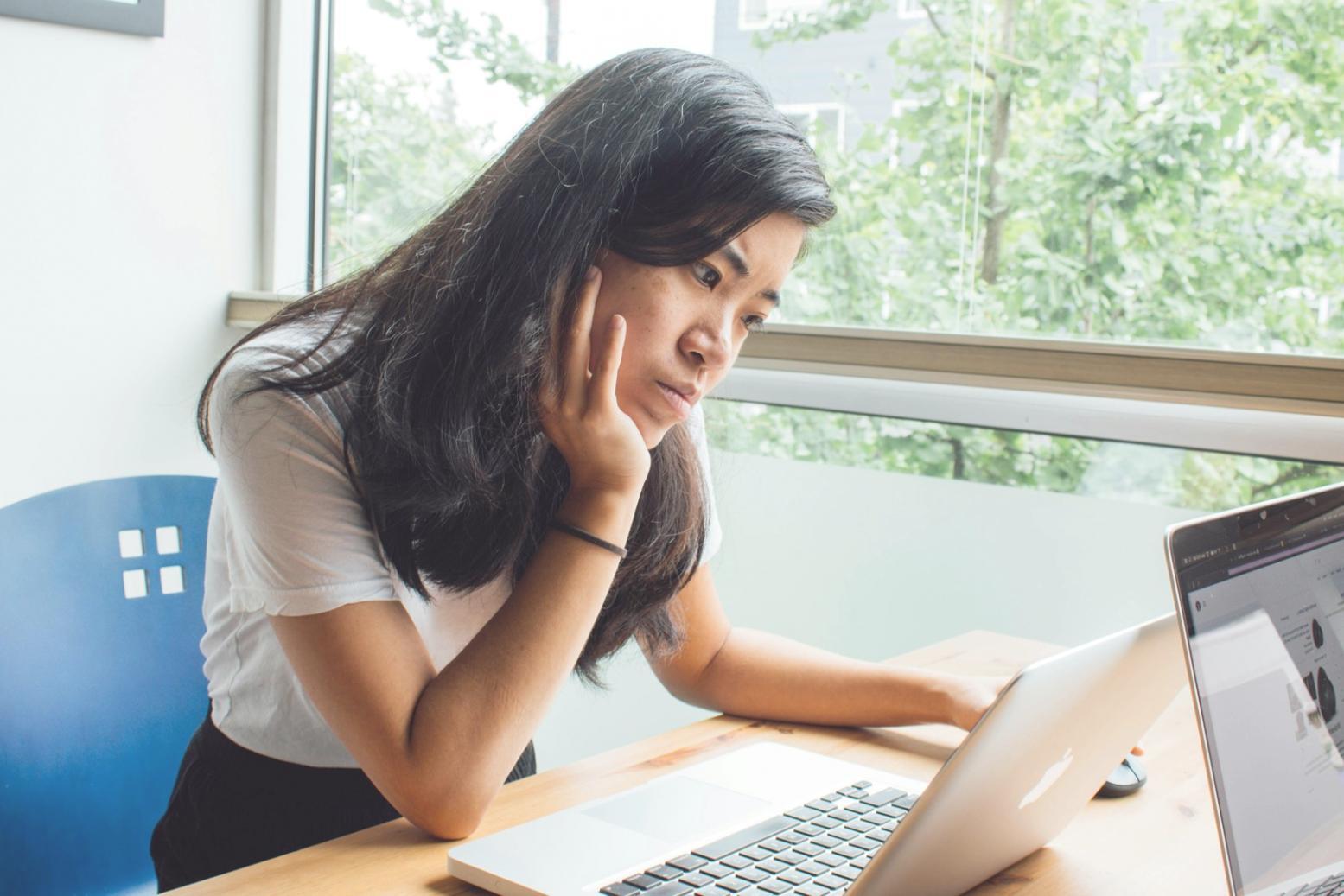 Experienced business mentor reviewing financial documents and strategies