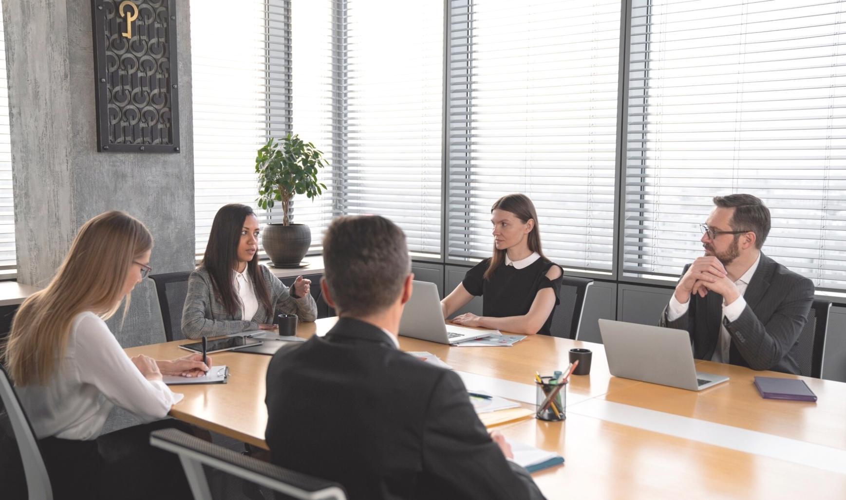 Business owner reviewing financial reports and planning documents
